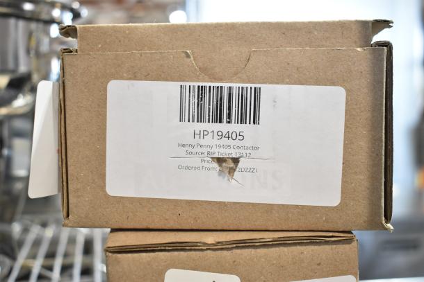 Brown cardboard box labeled "HP19405 Henny Penny 19405 Contactor," showing a slight dent.