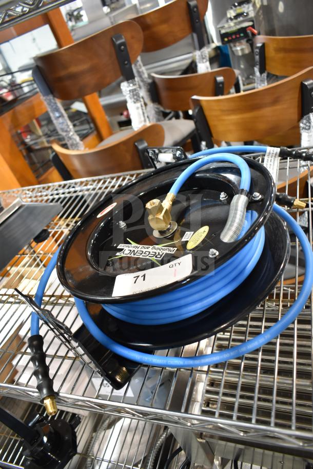 Regency black powder-coated steel open air/water hose reel with blue hose, brand new, slight scratch and dent.