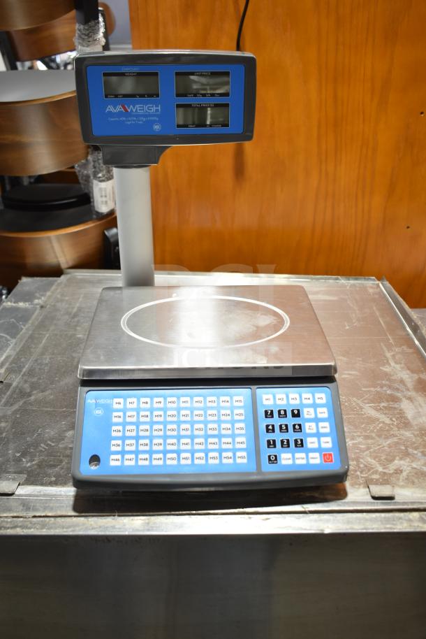 BRAND NEW AvaWeigh 334PCS40T 40 lb. digital price computing scale with tower, visible scratches and dents, blue display.