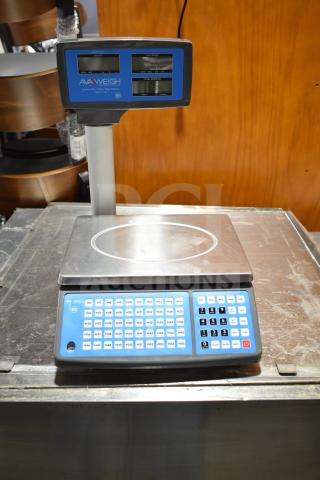 BRAND NEW AvaWeigh 334PCS40T 40 lb. digital price computing scale with tower, visible scratches and dents, blue display.
