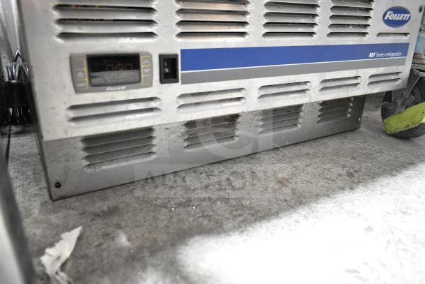 Follett REF5-00-0000 commercial undercounter cooler, 115 volts, worn exterior with visible venting and control panel.