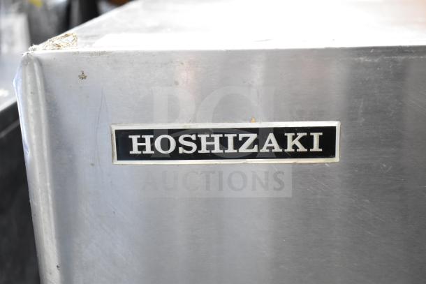 Hoshizaki KM-900MRH commercial ice machine head, 208-230V, 1 phase, metal casing with visible Hoshizaki label, good condition.