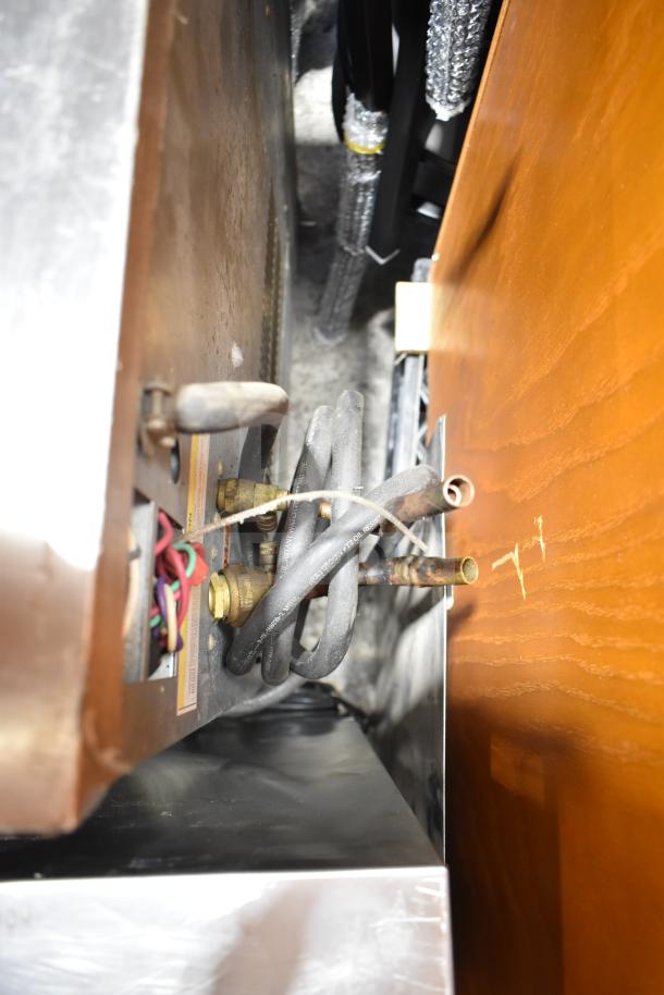 Hoshizaki KM-900MRH commercial ice machine head. Visible wiring and connectors. 208-230 volts, 1 phase.