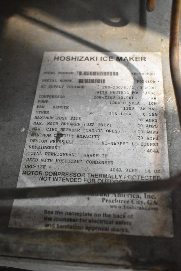 Hoshizaki KM-900MRH ice machine label showing model, voltage (208-230V), phase (1), and safety information.