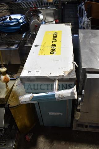 US Range commercial counter with metal handle, visible wear, and "Park Tavern" label. Suitable for restaurant use.
