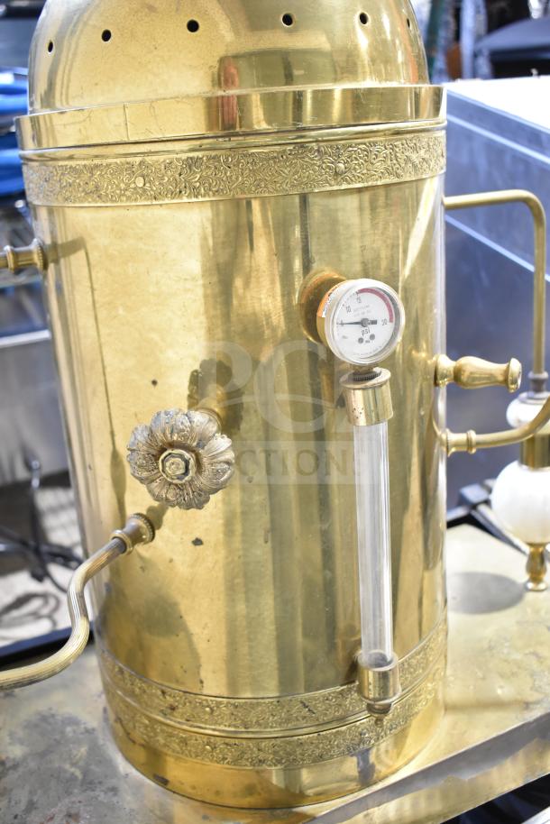 Astra brass commercial espresso machine, countertop 2 group, with steam wand, decorative detailing, visible gauge.