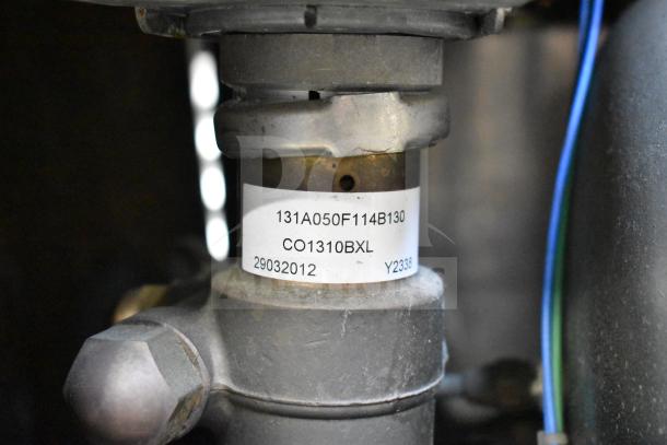 Astra Commercial Countertop 2 Group Espresso Machine with Steam Wand, showing internal component with label: 131A050F114B130, CO1310BXL, 29032012, Y2338.