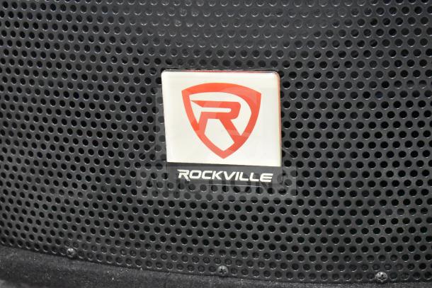 Rockville SBG1128 DJ subwoofer front view, featuring a 12" speaker, black mesh grille with logo, 600W, 8 Ohm.