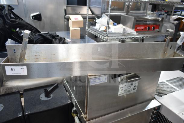 Stainless steel commercial fryer, Speedwell brand, with grease and wear marks, auction tag 81 visible, PCI Auctions.