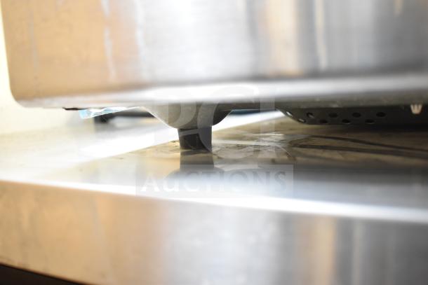 Sharp R-21LCFS Microwave Oven, 120V, 1 Phase, stainless steel exterior, countertop model, inspected underside features.