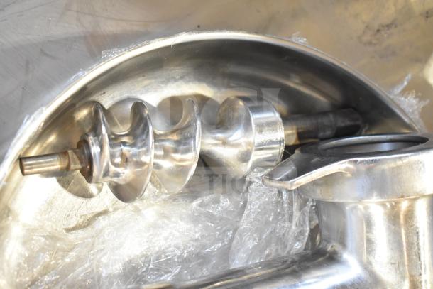 Stainless steel meat grinder attachment with auger and tray, shown in good condition. Ideal for kitchen use.