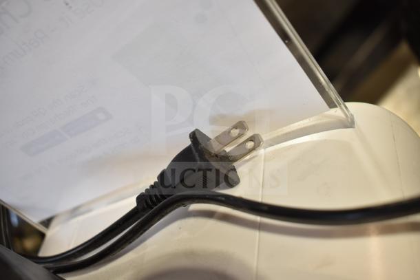 SmartShared CS-S08 Charging Station with power cord, good condition, white surface, and visible plug detail.