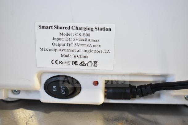 SmartShared CS-S08 Charging Station, input/output 5V 8A max, label shows specs and CE, RoHS, FC marks, with on/off switch.