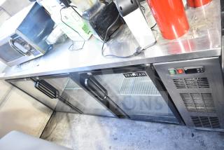 Spartan SGBB-79 commercial 3-door back bar cooler merchandiser in stainless steel, 115 volts, with glass doors.