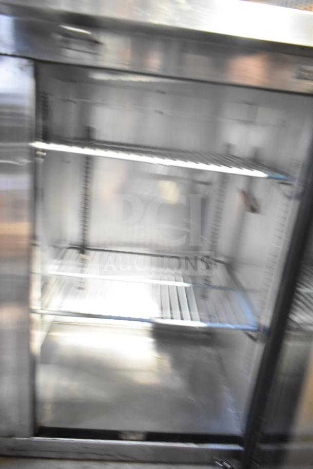 Spartan SGBB-79 Commercial 3 Door Back Bar Cooler, stainless steel, 115V, interior shelves visible.