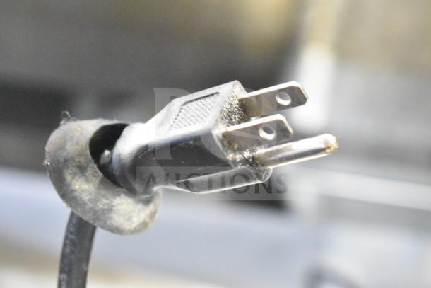 Close-up view of a power plug from the Spartan SGBB-79 Commercial 3 Door Back Bar Cooler, 115 volts, 1 phase configuration.
