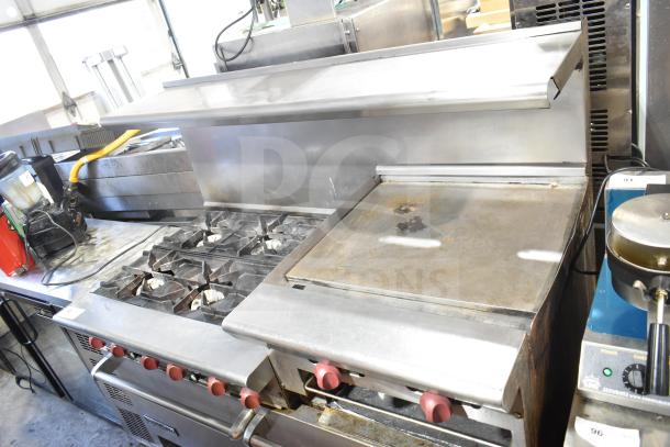 American Range commercial 6-burner stove with flat top, 2 ovens, overshelf, and backsplash. Stainless steel, lightly used.