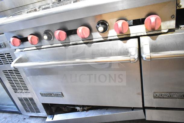 American Range commercial 6 burner range with flat top, 2 ovens, over shelf, and backsplash in stainless steel.