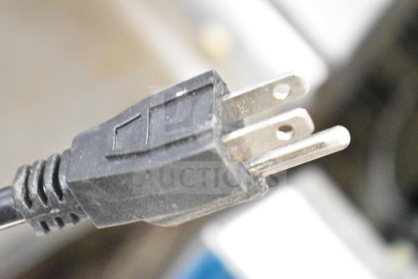 Close-up of the plug for the 2024 Carnival King 382WBM13 Belgian Waffle Maker, 120 volts, non-stick, with timer.