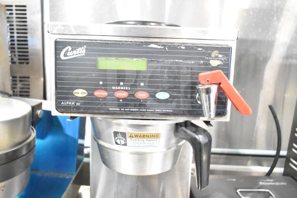 Curtis ALP3GT12A000 commercial coffee machine with 3 burners and hot water dispenser, 120V, visible control panel, and warning label.