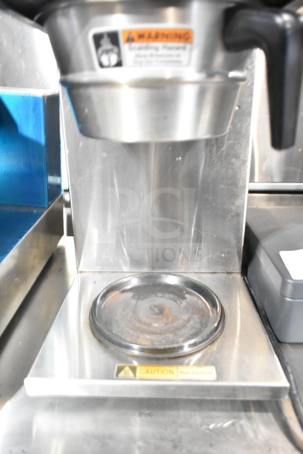 Curtis ALP3GT12A000 commercial coffee machine with three burners and hot water dispenser, stainless steel, visible warning labels.