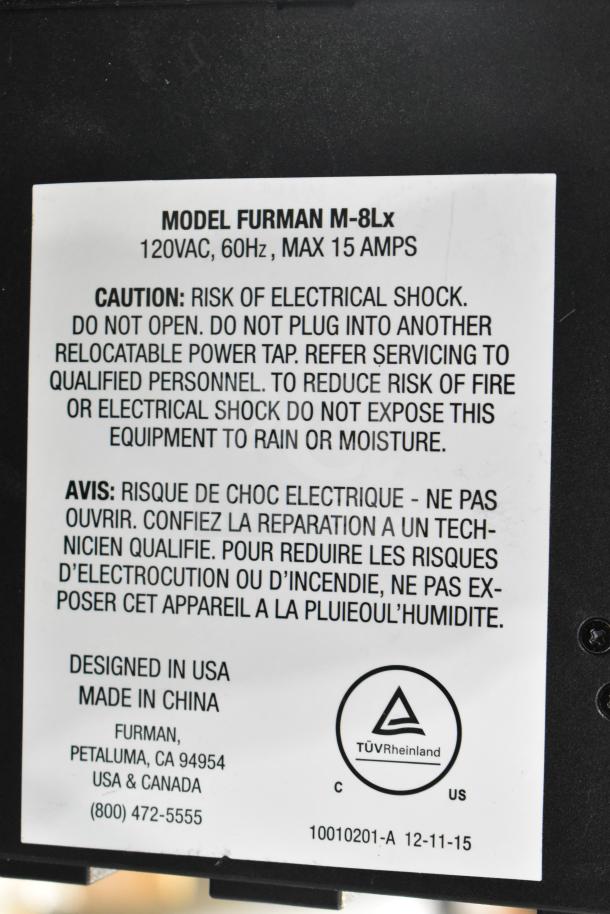 Furman M-8Lx power conditioner label showing model, voltage, and caution info, made in China, designed in USA.