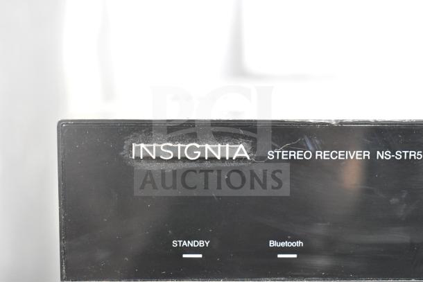 Insignia Stereo Receiver NS-STR514, black casing with visible markings for standby and Bluetooth.