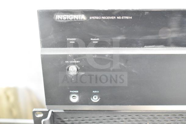 Insignia Stereo Receiver NS-STR514, featuring standby button, phone input, and AUX 3 port. Light wear visible.