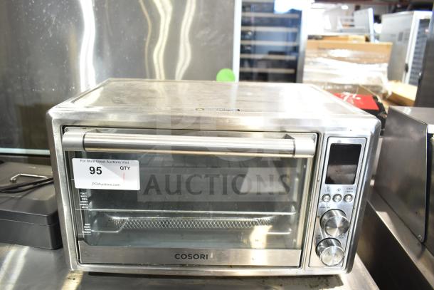 Cosori CO130-AO Countertop Air Fryer Toaster Oven, stainless steel, with control panel and tag marked "95." 120V, 1 Phase.