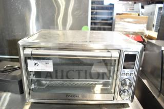 Cosori CO130-AO Countertop Air Fryer Toaster Oven, stainless steel, with control panel and tag marked "95." 120V, 1 Phase.