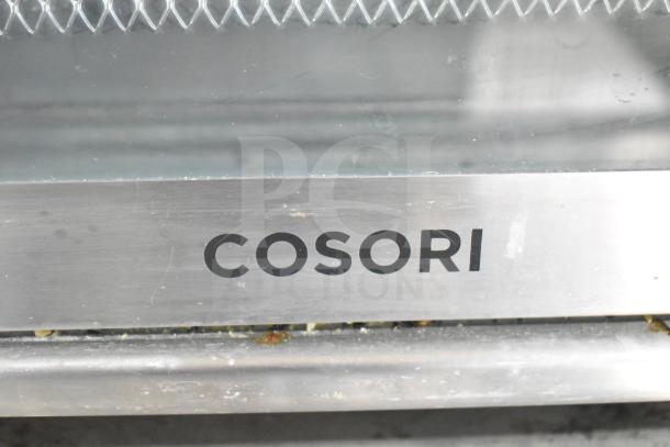 Cosori CO130-AO air fryer toaster oven, stainless steel finish, visible logo, 120 volts operation.