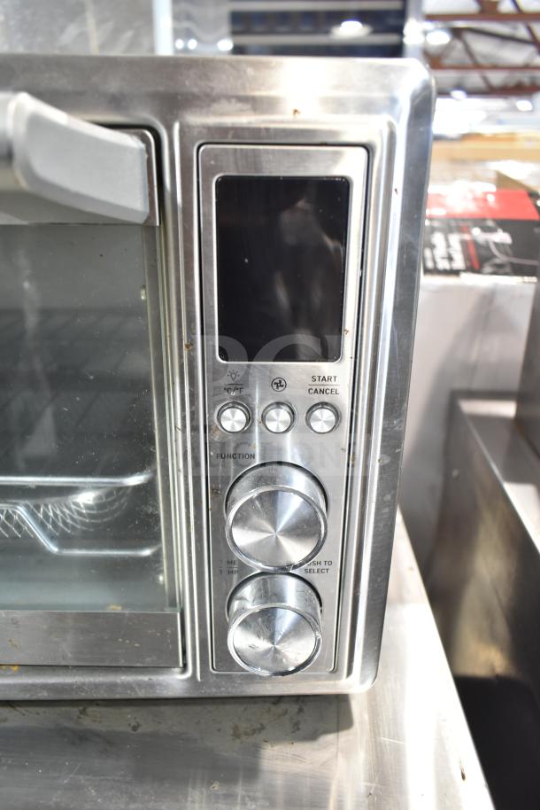 Cosori CO130-AO air fryer toaster oven, stainless steel, visible control panel and knobs, 120V, used condition.