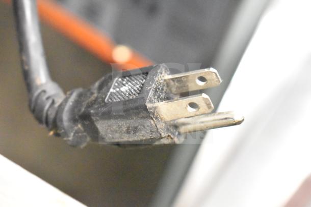 Close-up image of a power plug for the Spartan SGBB-58 back bar cooler.