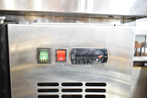 Spartan SGBB-58 back bar cooler controls, showcasing power and settings. Stainless steel surface. Used condition.