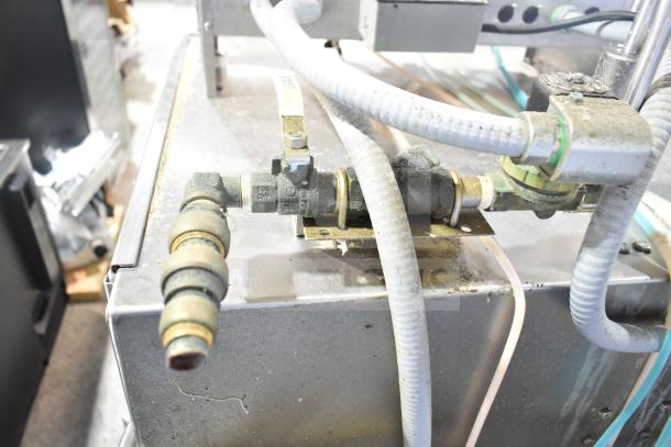 American Dish Service ADS AF-3DS commercial dishwasher connections. Stainless steel body, industrial hoses, visible wear.