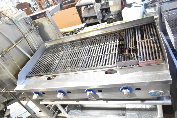 Globe Commercial countertop gas charbroiler grill on stand with casters; features adjustable knobs and durable grates.