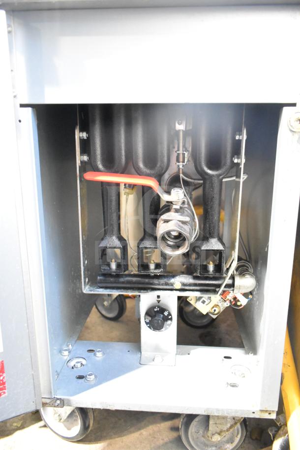 2024 Qualite QL-9/NG commercial gas fryer, 90,000 BTU, with two metal baskets. Features control dial and internal components visible.