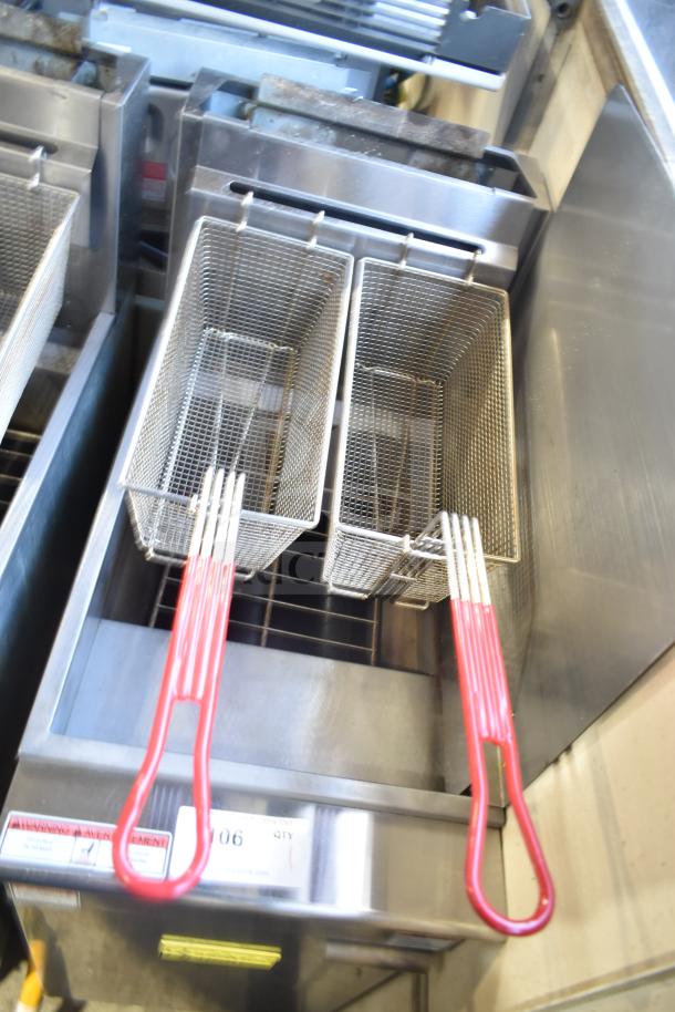 2024 Qualite QL-9/NG natural gas fryer with 2 metal fry baskets, red handles, on commercial casters. 90,000 BTU.