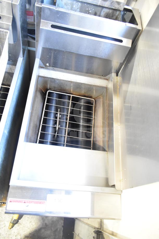 2024 Qualite QL-9/NG commercial floor-style natural gas fryer with 2 metal baskets, 90,000 BTU, on casters.