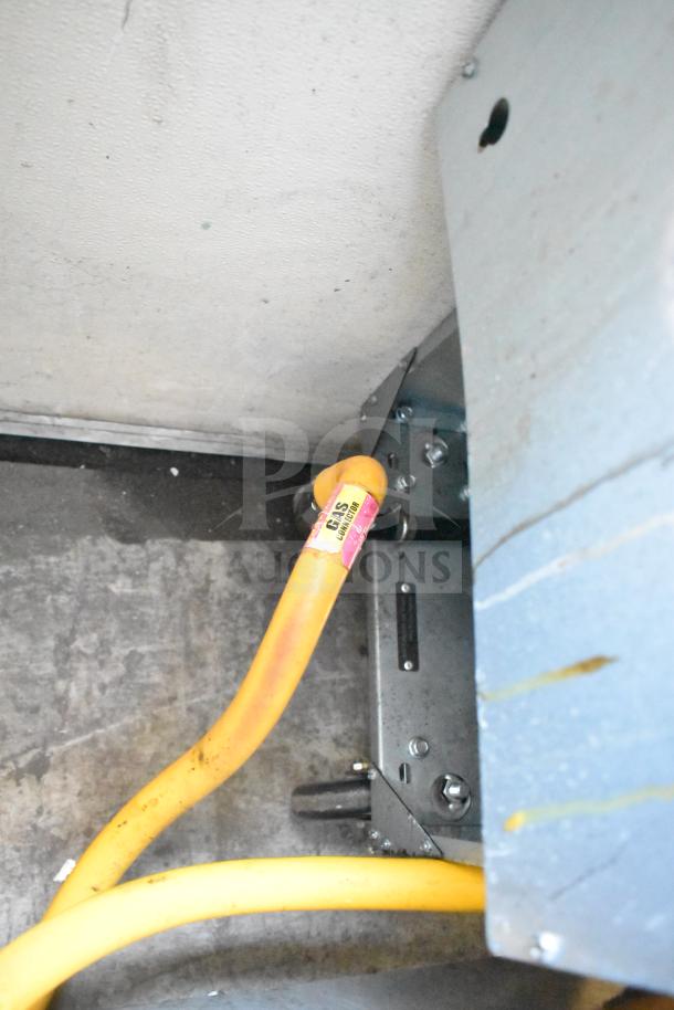 2024 Qualite QL-9/NG commercial deep fat fryer, natural gas powered, metal fry baskets, on commercial casters, 90,000 BTU.