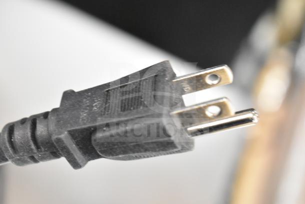 Power plug for Vollrath COV-120-HS convection oven, 120V, showing standard prongs. Brand new, scratch and dent condition.