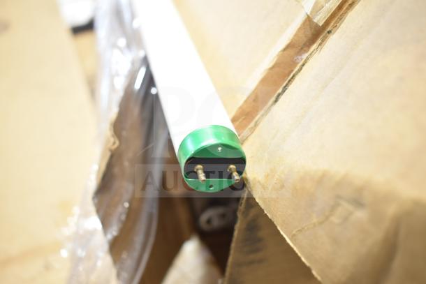 12 fluorescent tube lights, brand new scratch and dent condition, end cap detail visible, boxed for auction.