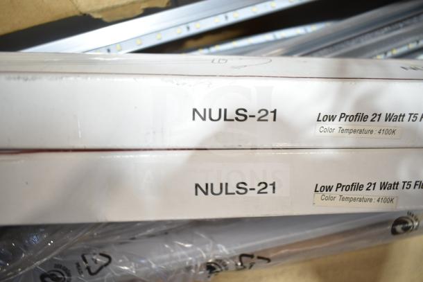 Boxes of NULS-21 Low Profile 21W T5 fluorescent tube lights, color temperature 4100K. Scratch and dent condition.