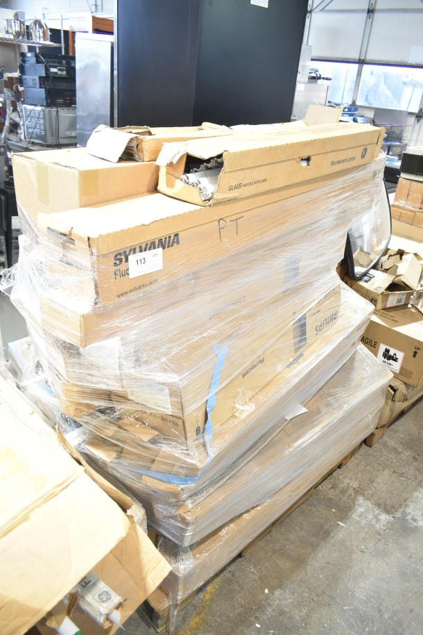 A pallet of 20 new scratch and dent GE/Philips fluorescent tube lights in original boxes, some wear visible, labeled for sale.