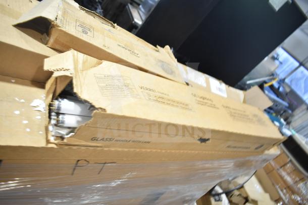 Brown cardboard box containing new GE/Philips fluorescent tube lights, labeled as scratch and dent items. Box is partially opened.