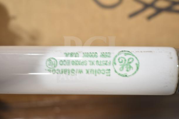 GE fluorescent tube light, new with scratch and dent marks. Features EcoLux W/Starcoat, made in USA print.