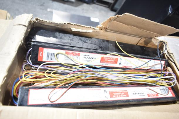 20 brand new GE/Philips fluorescent tube lights in box. Visible labels show 277V, Philips Advance. Boxed wires included.