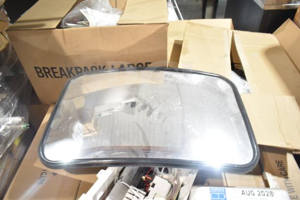 12 new scratch and dent items, including GE ballasts and DualLite LED emergency light back box, in boxes.