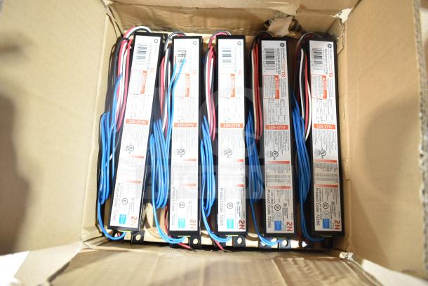 Box of 12 new GE ballasts, labeled 120-277V, scratch and dent condition, various colored wires visible.