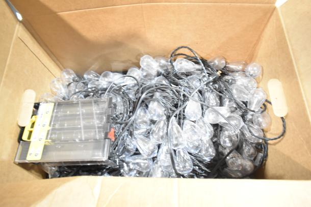 Box of 12 brand new scratch and dent items, including GE ballasts and DualLite LED emergency light back box.
